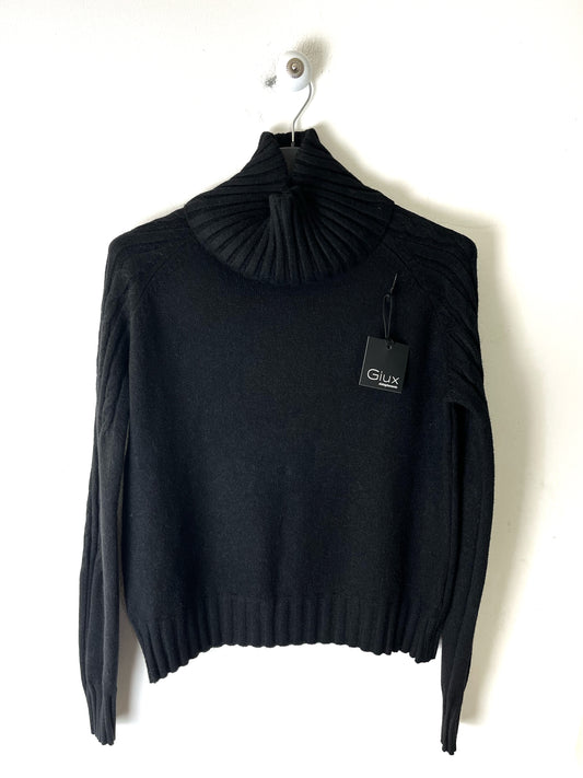 Dolcevita cropped con trecce